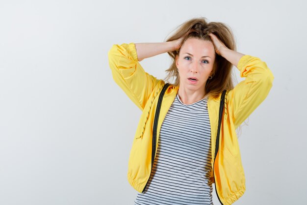 Expressive young woman posing in the studio