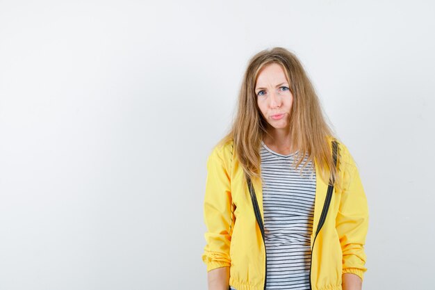 Expressive young woman posing in the studio