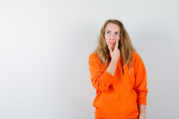 Expressive young woman posing in the studio