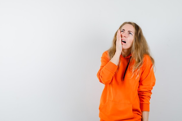 Expressive young woman posing in the studio