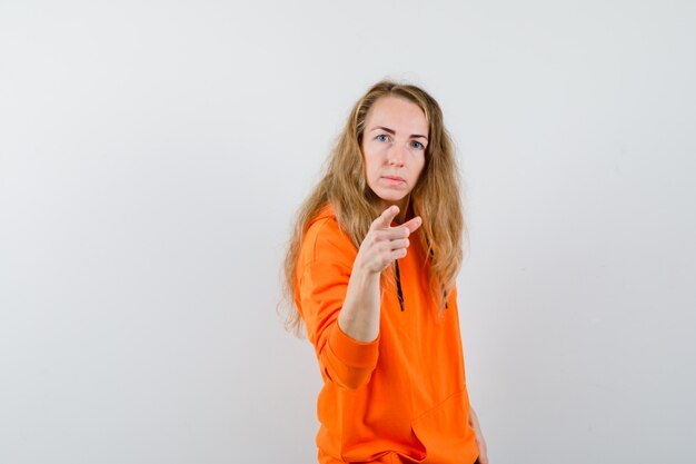 Expressive young woman posing in the studio