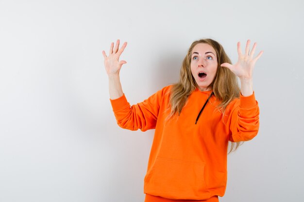 Expressive young woman posing in the studio