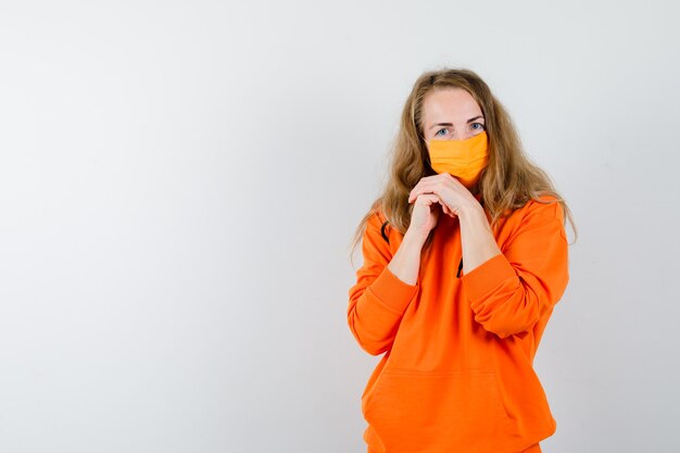 Expressive young woman posing in the studio