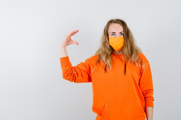 Expressive young woman posing in the studio