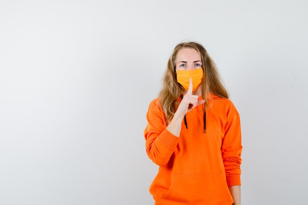 Expressive young woman posing in the studio