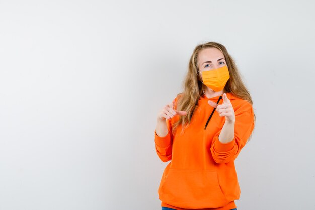 Expressive young woman posing in the studio