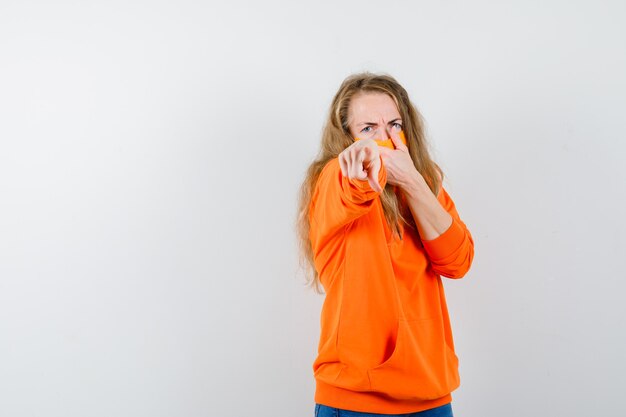 Expressive young woman posing in the studio