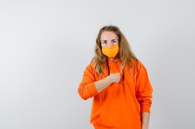 Expressive young woman posing in the studio