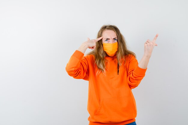 Expressive young woman posing in the studio