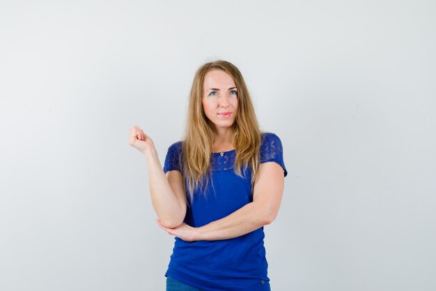 Expressive young woman posing in the studio