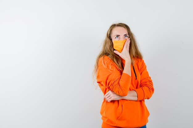 Expressive young woman posing in the studio