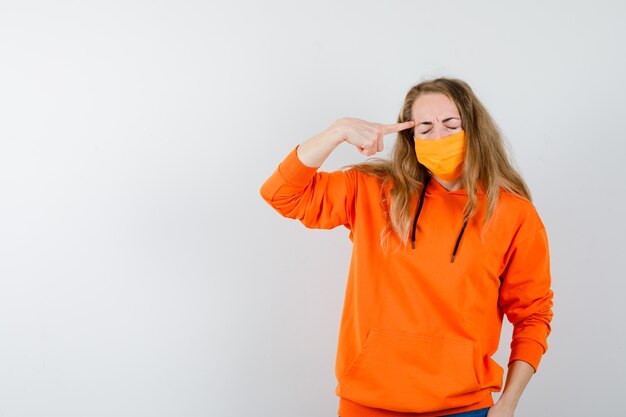 Expressive young woman posing in the studio