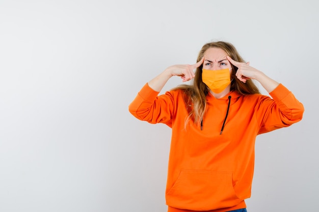 Expressive young woman posing in the studio