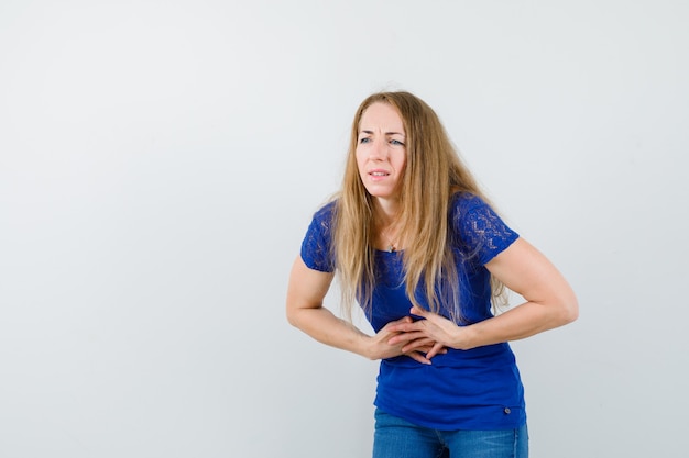 Expressive young woman posing in the studio