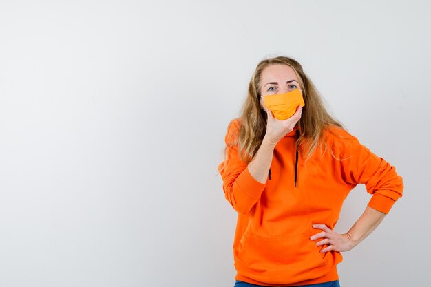 Expressive young woman posing in the studio