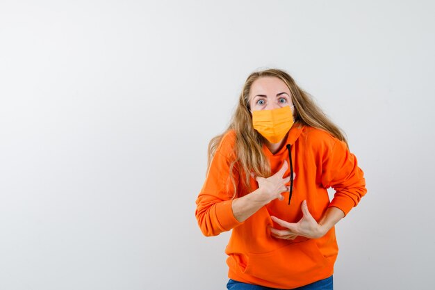 Expressive young woman posing in the studio