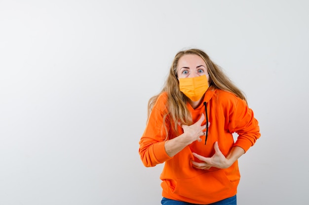 Expressive young woman posing in the studio