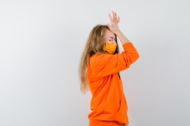 Expressive young woman posing in the studio