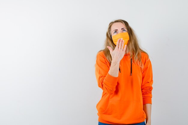 Expressive young woman posing in the studio