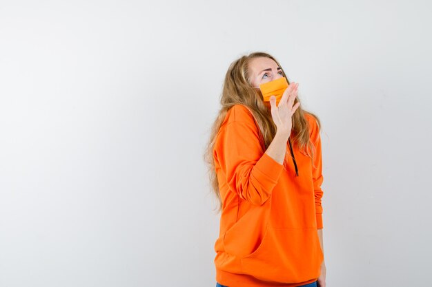 Expressive young woman posing in the studio