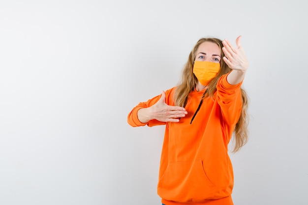 Expressive young woman posing in the studio