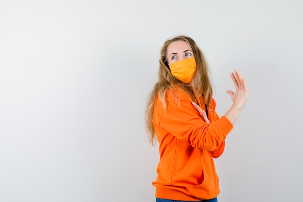 Expressive young woman posing in the studio