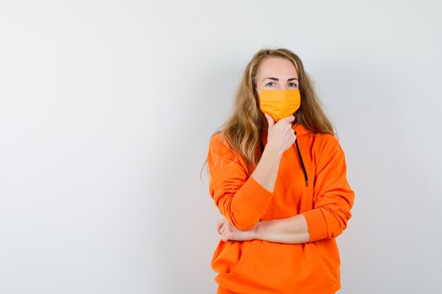 Expressive young woman posing in the studio