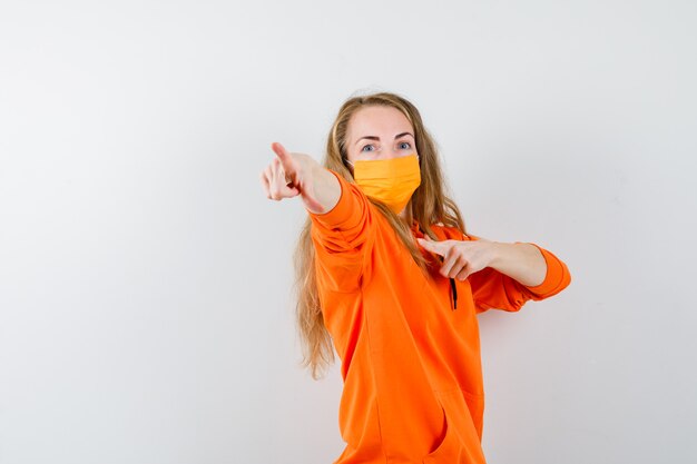 Expressive young woman posing in the studio