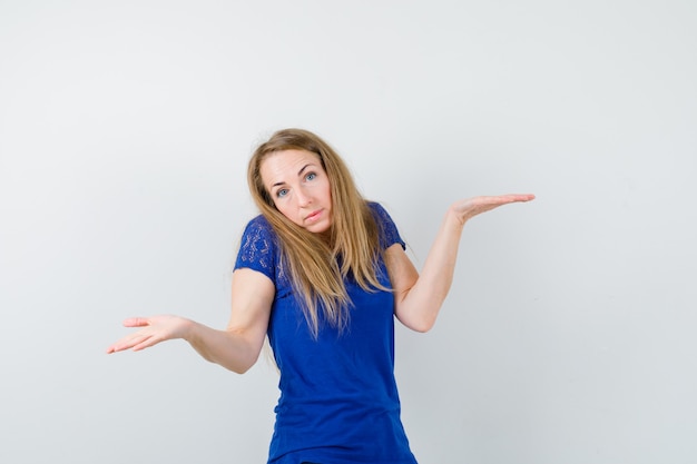 Expressive young woman posing in the studio