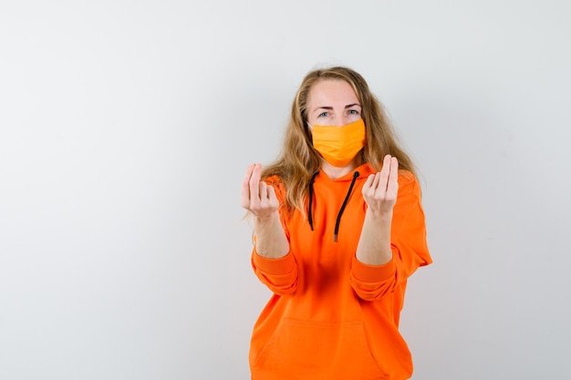 Expressive young woman posing in the studio