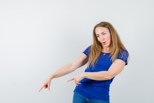 Expressive young woman posing in the studio