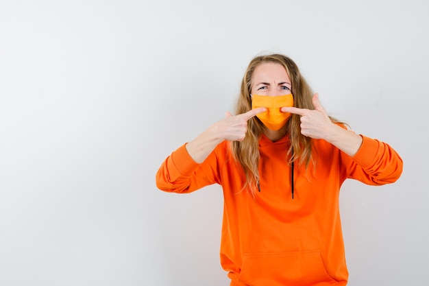 Expressive young woman posing in the studio