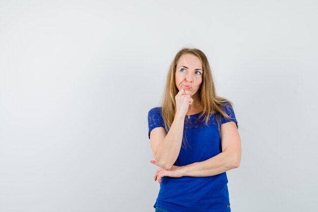 Expressive young woman posing in the studio