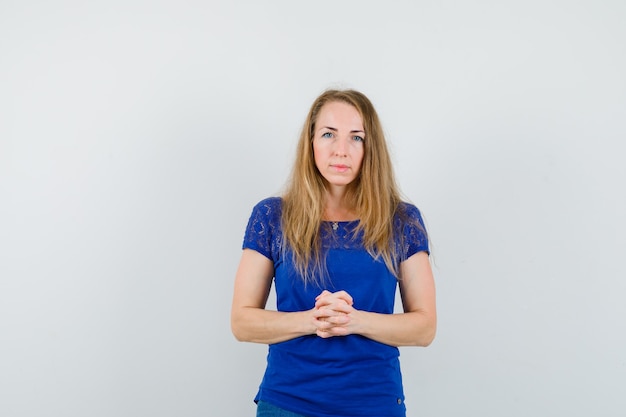 Expressive young woman posing in the studio