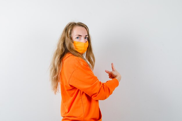 Expressive young woman posing in the studio