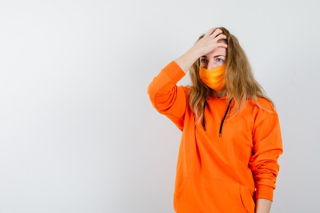 Expressive young woman posing in the studio