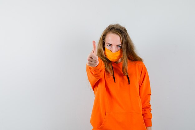 Expressive young woman posing in the studio