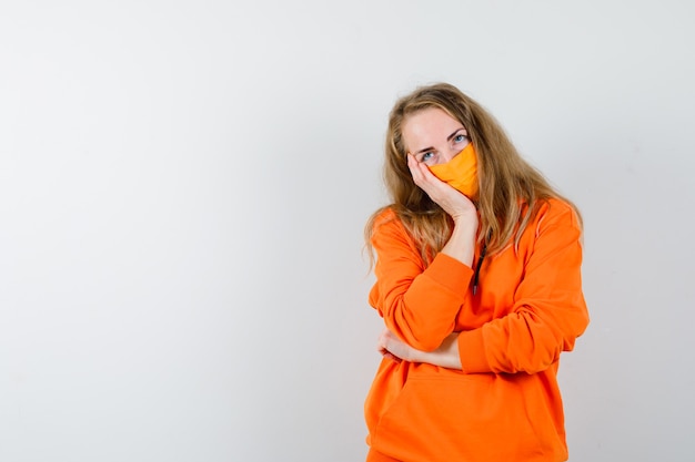 Expressive young woman posing in the studio