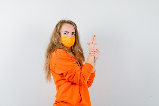 Expressive young woman posing in the studio