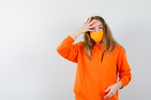 Expressive young woman posing in the studio