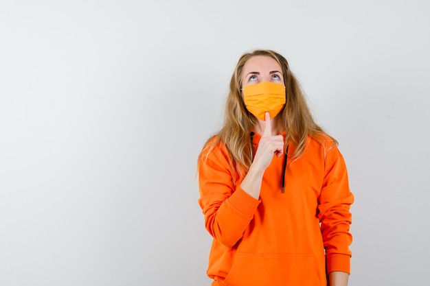 Expressive young woman posing in the studio