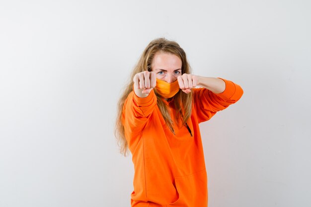 Expressive young woman posing in the studio