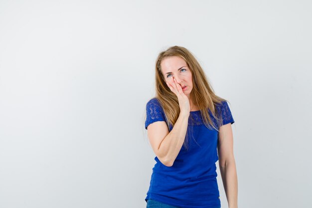 Expressive young woman posing in the studio