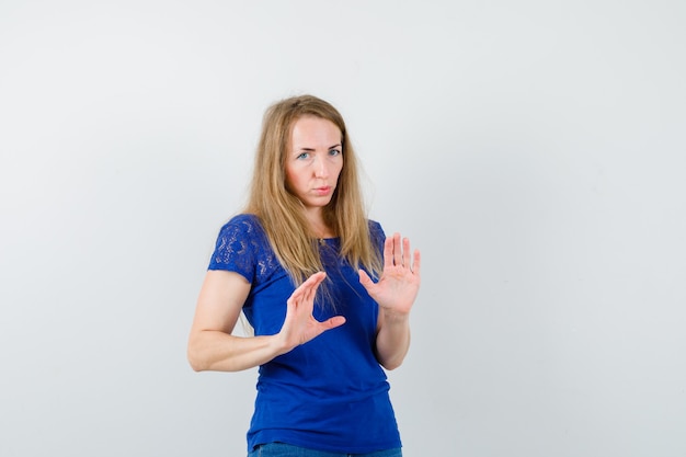 Expressive young woman posing in the studio