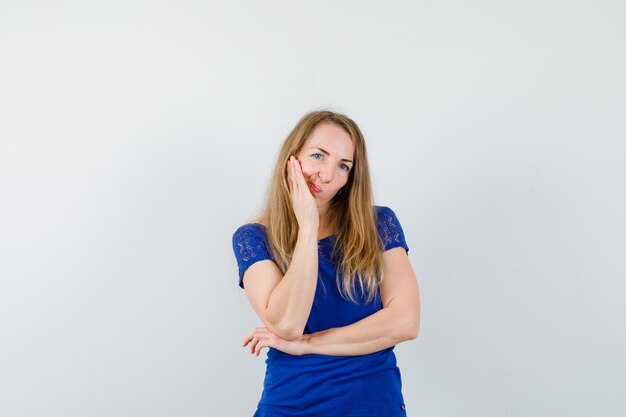 Expressive young woman posing in the studio