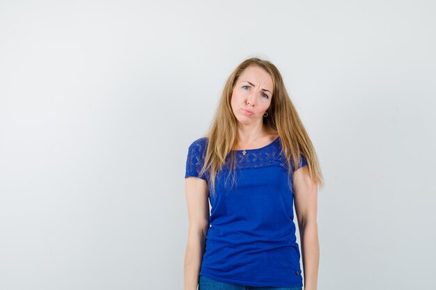 Expressive young woman posing in the studio