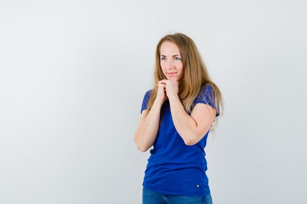 Expressive young woman posing in the studio