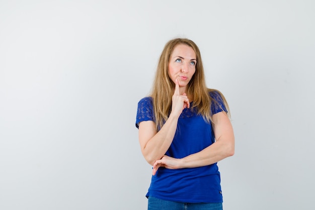 Expressive young woman posing in the studio