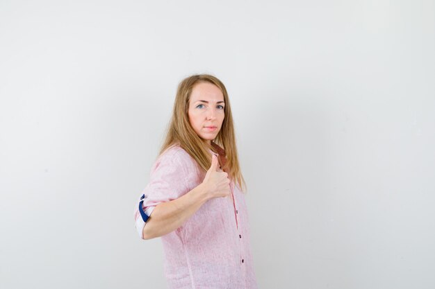 Expressive young woman posing in the studio