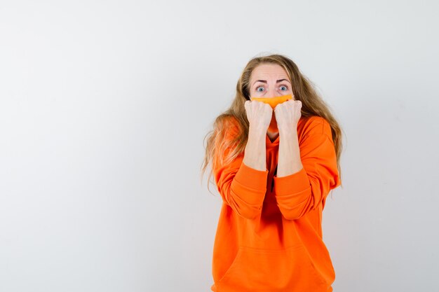 Expressive young woman posing in the studio